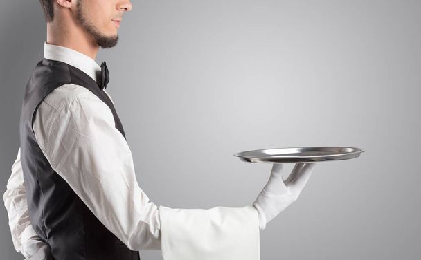 Waiter serving with white gloves and steel tray - Photo, image