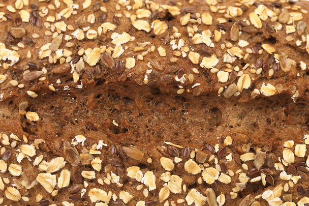 Background of grain brown bread. - Foto, imagen