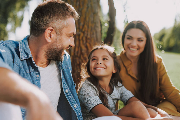 Smiling family is spending nice weekend outdoor - Photo, Image