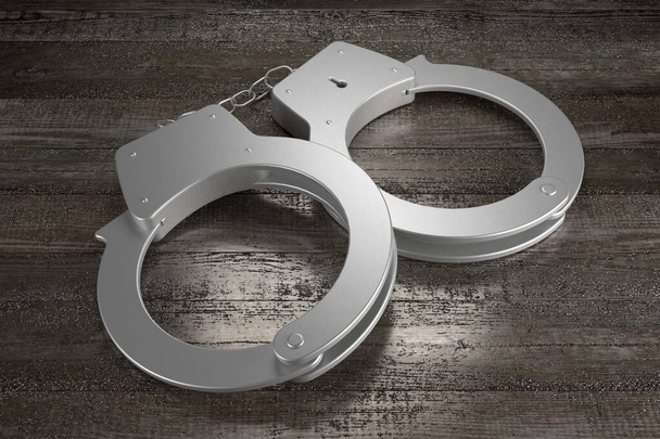 3D law, crime concept - handcuffs, wooden background - Фото, изображение
