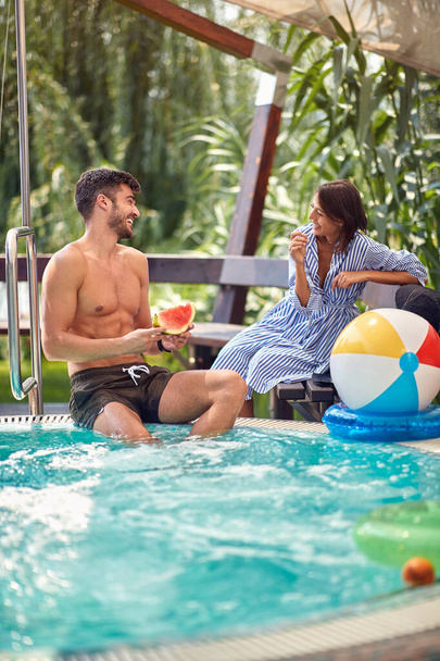Couple on swimming pool having fun - Zdjęcie, obraz