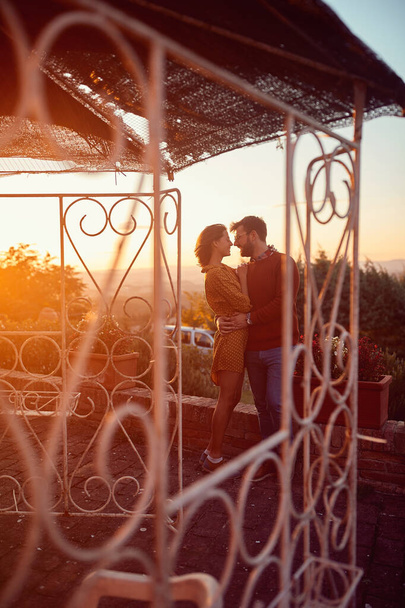 romantic couple kissing at sunset - 写真・画像