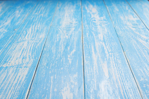 empty blue wooden table in front - Foto, imagen