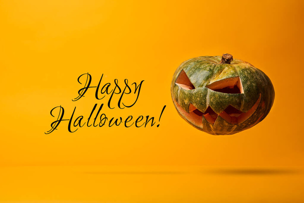 Halloween pumpkin and inscription on blank orange background. - Фото, зображення