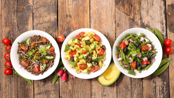 mixed vegetarian salad in bowl, top view - Photo, image