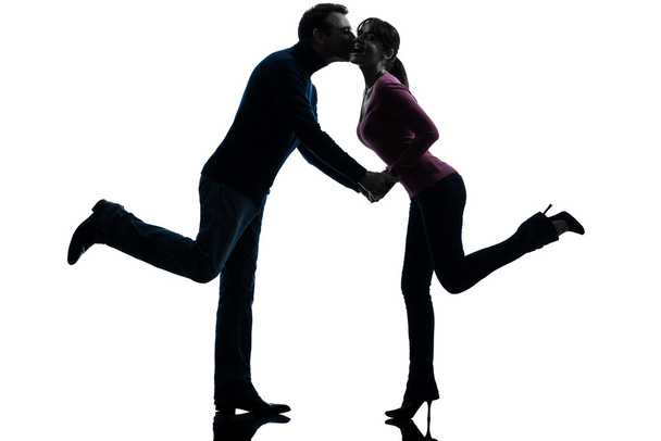 Couple woman man lovers kissing silhouette - Foto, imagen