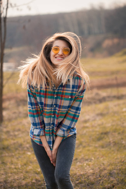 Young cheerful woman having fun on nature - Fotó, kép