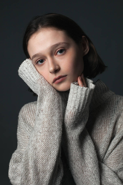 Portrait of beautiful girl in sweater. - Фото, изображение