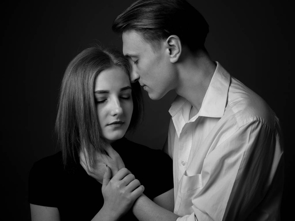 Passionate couple in studio. Black and white. - Fotó, kép
