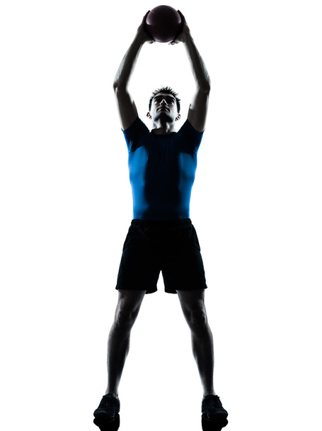 man exercising workout holding fitness ball posture - Foto, Bild