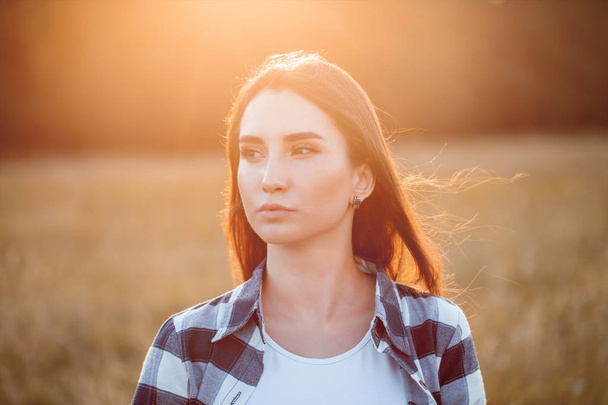 Portrait of the beautiful young woman outdoors. Close up. Flare - Zdjęcie, obraz