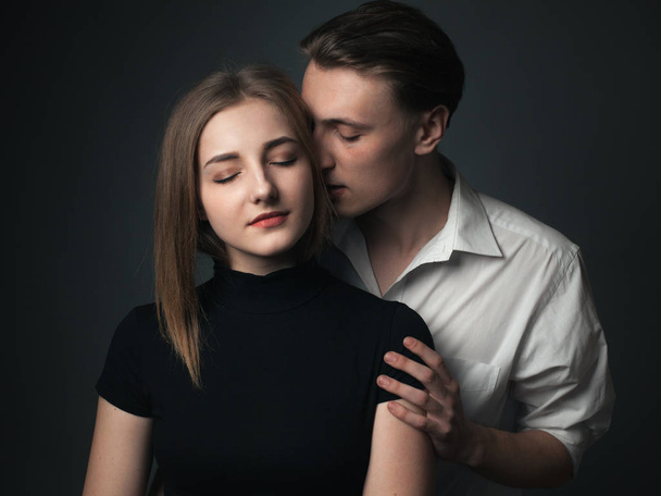 Young passionate couple in love posing in studio - Foto, Imagem