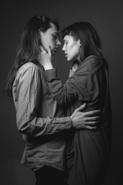 Portrait of young beautiful couple. Studio. Black and white. - Photo, image