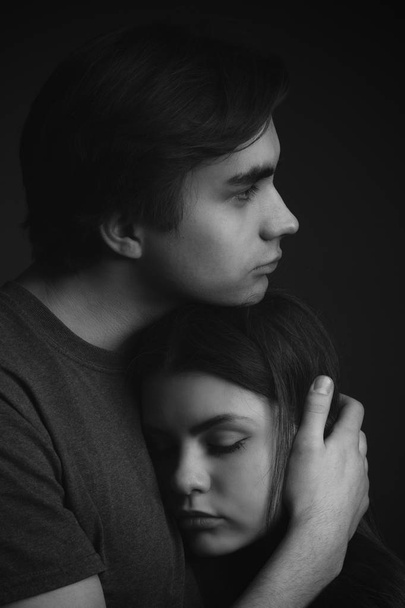 Beautiful young couple in studio. Black and white - Photo, image