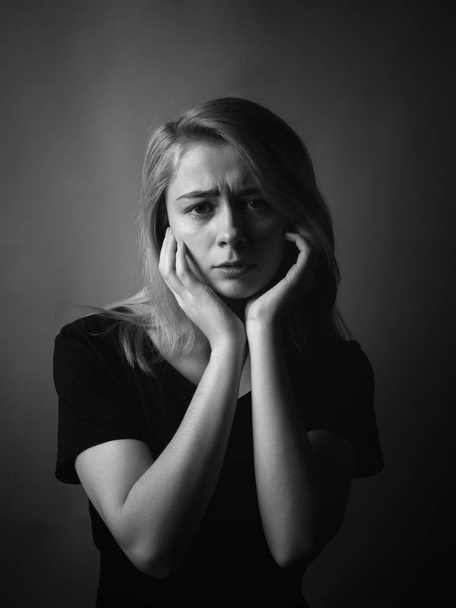 Young woman in depression. Black and white. - Фото, изображение