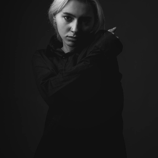 Young woman in black shirt. Black and white - Fotografie, Obrázek
