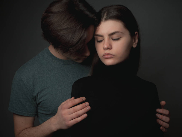 Young couple in love hugging in studio. - Valokuva, kuva