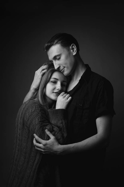 Portrait of gentle young couple in studio.Black and white - 写真・画像