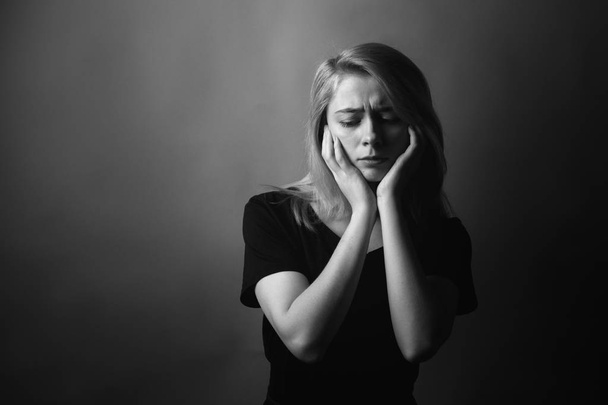 Young woman in depression. Black and white. - Foto, afbeelding