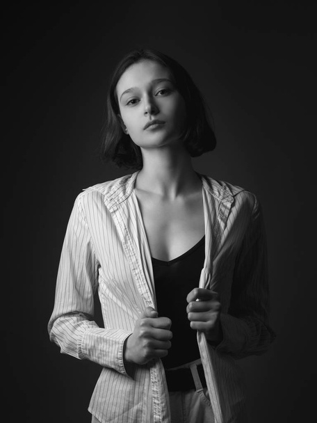 Portrait of thin young woman in shirt. Black in white. - Foto, Imagem