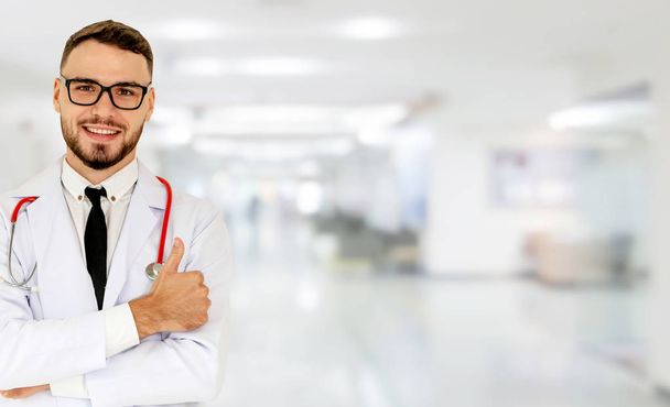 Young male doctor working at the hospital. - Foto, Imagen
