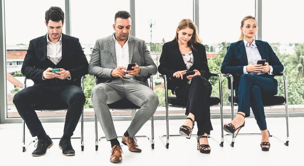 Businesswomen and businessmen using mobile phone. - Foto, Bild