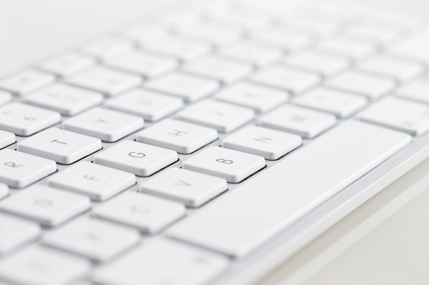 A close-up of a white computer keyboard - Фото, изображение