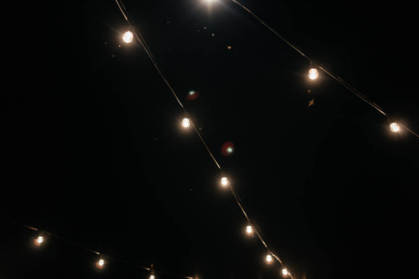 Garlands lighting in the dark - Photo, Image