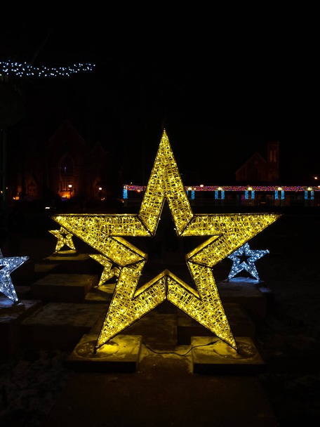 The golden star at the city center during holidays - Photo, Image