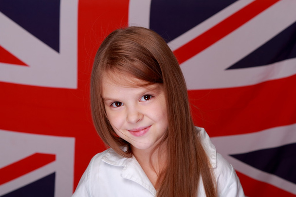 Girl on the background of the flag of Great Britain - Valokuva, kuva