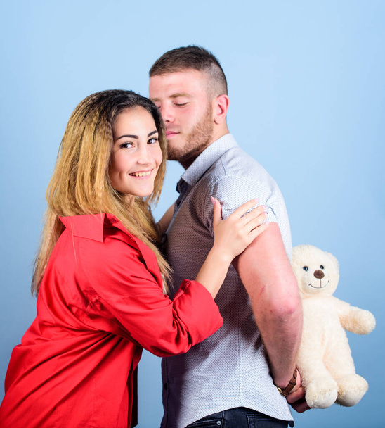 Handsome man and pretty girl in love. Man and woman couple in love. Romantic surprise. Valentines day holiday. Surprise for sweetheart. Soft toy teddy bear gift. Surprise gift concept. Surprising her - Foto, Bild