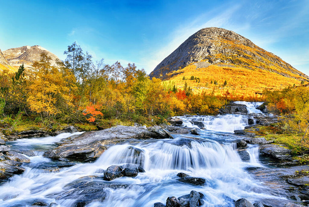 Beautiful autumn landscape with yellow trees and waterfall - Photo, Image