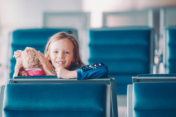 Little kid in airport waiting for boarding - Fotó, kép