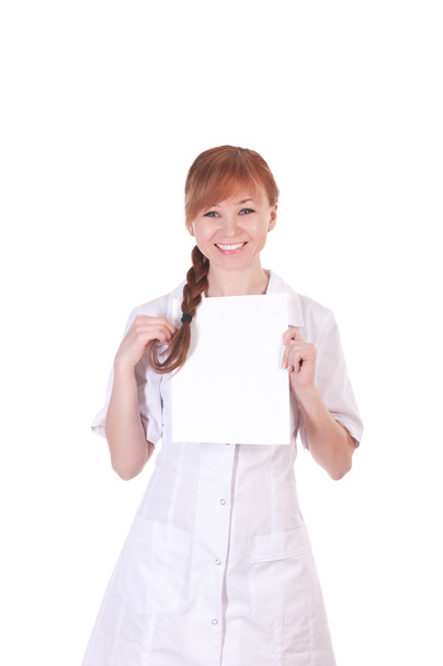 Young woman doctor is holding blank paper - Fotoğraf, Görsel