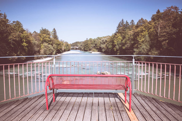 metal bench in the park with trees and river - Photo, Image