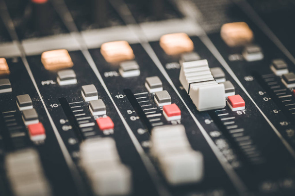 Close up of a professional recording mixer desk - Фото, изображение