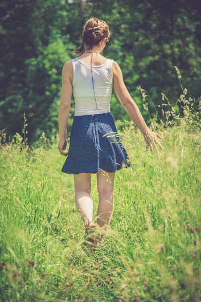 girl in green field at summer time - Fotó, kép