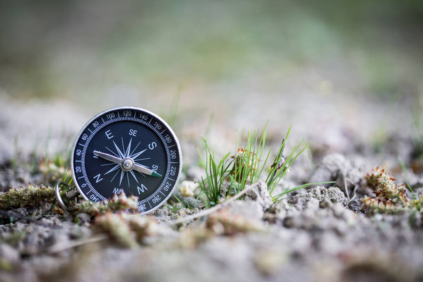Adventure: Compass is lying on the floor, showing the direction  - Fotografie, Obrázek