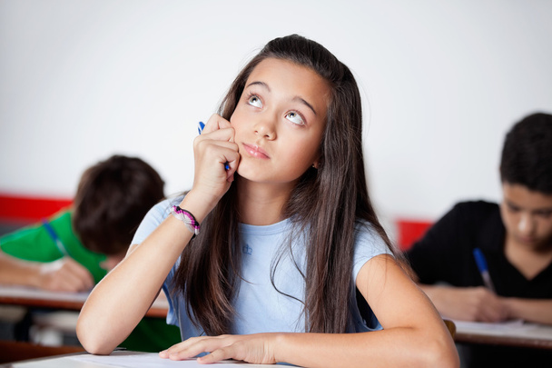 Thoughtful Teenage Schoolgirl Looking During Examination - Foto, Imagem