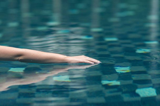 woman's hand in swimming pool. - Photo, Image