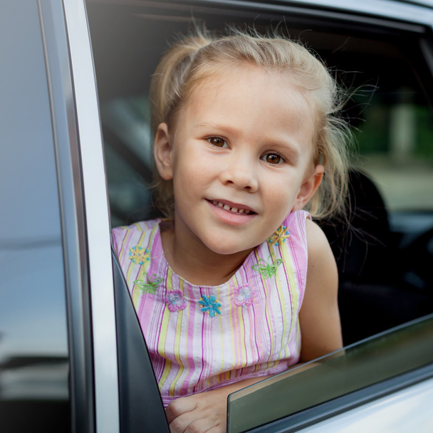 little girl sitting in the car - Photo, Image