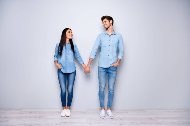 Happy valentines day. Full body photo of amazing pair in love holding arms excited to be together wear casual jeans clothes isolated grey color background - Foto, Imagem
