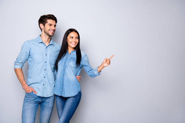 Portrait of his he her she nice-looking attractive charming cheerful cheery content couple wearing casual embracing pointing copy space isolated on light white gray pastel color background - Foto, Imagem