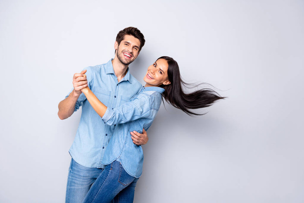 Portrait of his he her she nice attractive charming lovely cheerful cheery positive couple wearing casual dancing having fun enjoying free time isolated on light white gray pastel color background - Zdjęcie, obraz