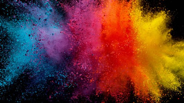 Explosion of colored powder on black background - Photo, Image