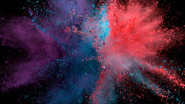 Explosion of colored powder on black background - Foto, afbeelding