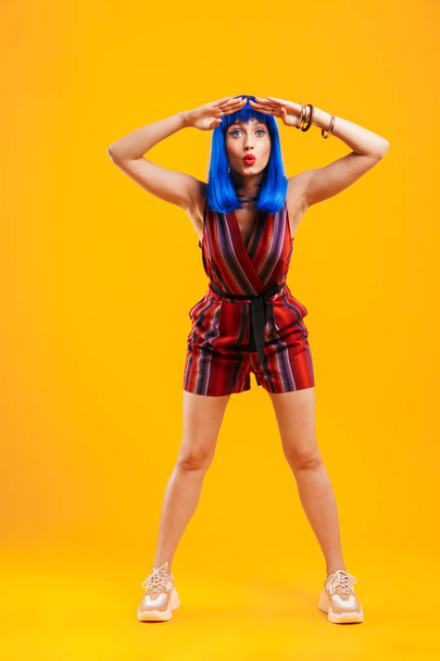 Portrait of an attractive funky young girl with blue hair - Fotoğraf, Görsel