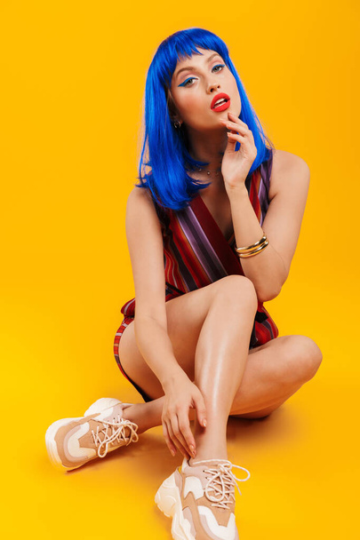 Portrait of an attractive funky young girl with blue hair - Φωτογραφία, εικόνα