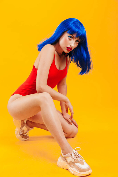 Portrait of an attractive young funky girl with blue hair - Foto, imagen