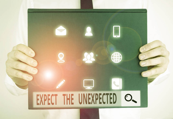 Text sign showing Expect The Unexpected. Conceptual photo Anything can Happen Consider all Possible Events Male human holding thick textured cardboard of business promotion concept. - Photo, Image